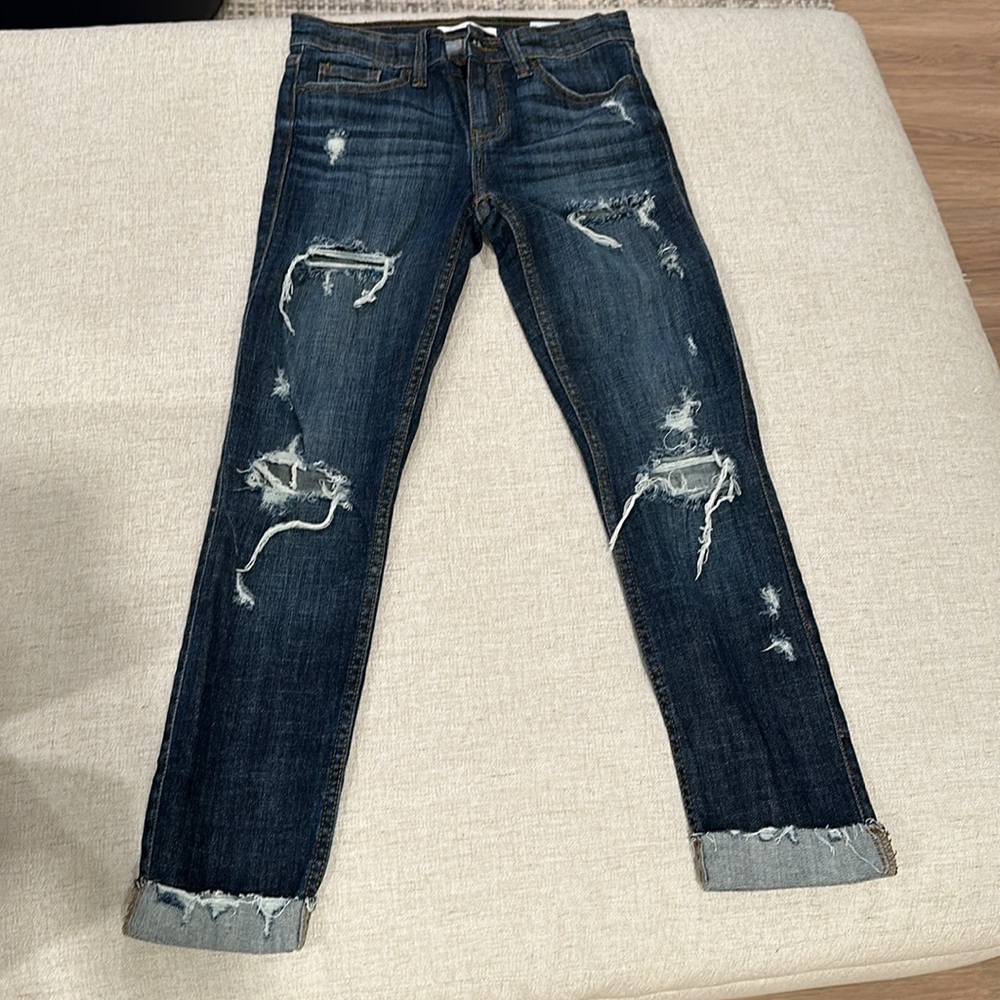Distressed darker jean